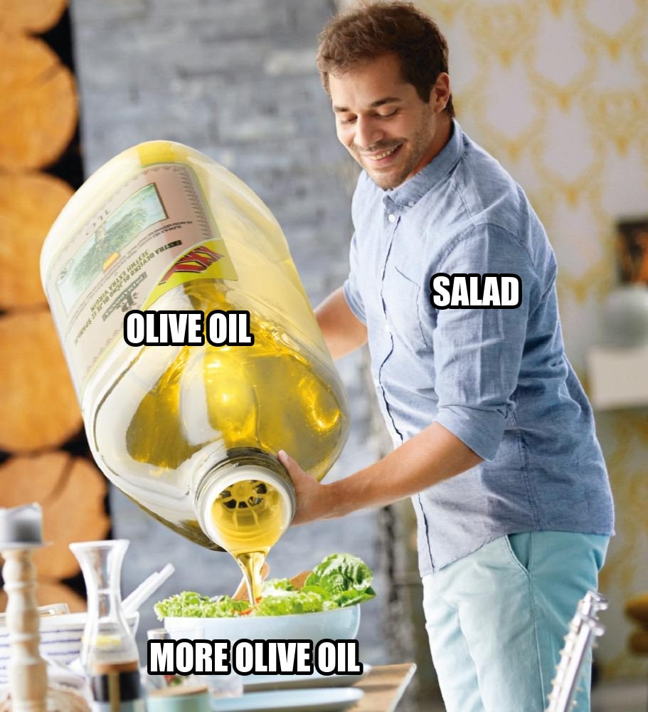 Guy pouring olive oil on the salad seeded example
