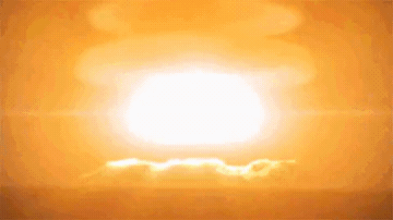 Add text to the Atomic Bomb Explosion reaction GIF template in Memesio. Set width, trim the clip, and make a share-ready GIF meme.