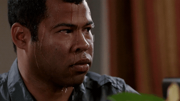 Add text to the Sweating Jordan Peele reaction GIF template in Memesio. Set width, trim the 1.1 second clip, and make a share-ready GIF meme.