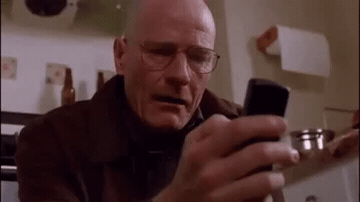 Add text to the Walter White Looking at Phone reaction GIF template in Memesio. Set width, trim the clip, and make a share-ready GIF meme.