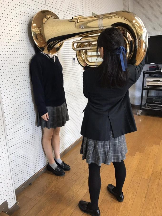Meme template Girl Putting Tuba on Girl's Head