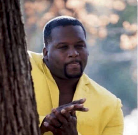 black man licking lips and rubbing hands in anticipation